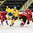 GRAND FORKS, NORTH DAKOTA - APRIL 18: Sweden's Jesper Bokvist #10 attempts to get by Switzerland's Livio Stadler #14 in order to play the puck while Thomas Lust #21 looks on during preliminary round action at the 2016 IIHF Ice Hockey U18 World Championship. (Photo by Minas Panagiotakis/HHOF-IIHF Images)

